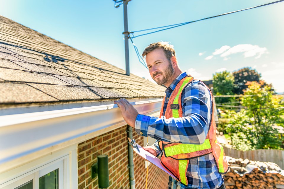 examiner looking at roof